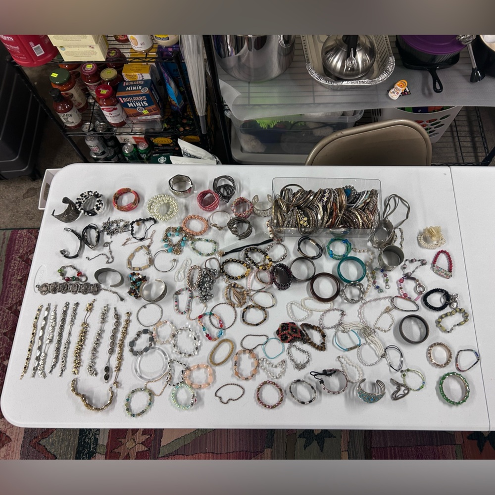 Lot of hundreds of bracelets.